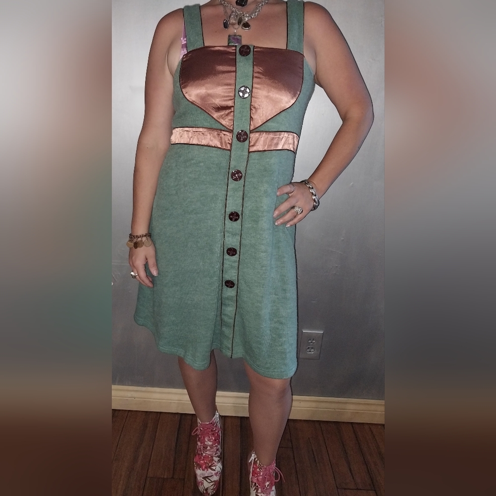 This is green dress with a copper  accent  top.